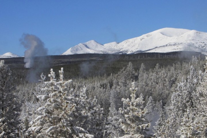 a person riding skis down a snow covered mountain